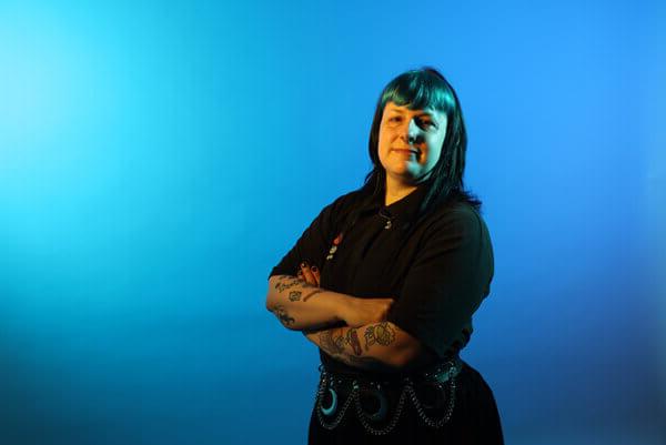 Miriam Wright, a Mitie colleague, against a blue background